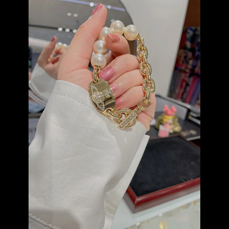 Vivienne Westwood pearl oval brand stitching bracelet
