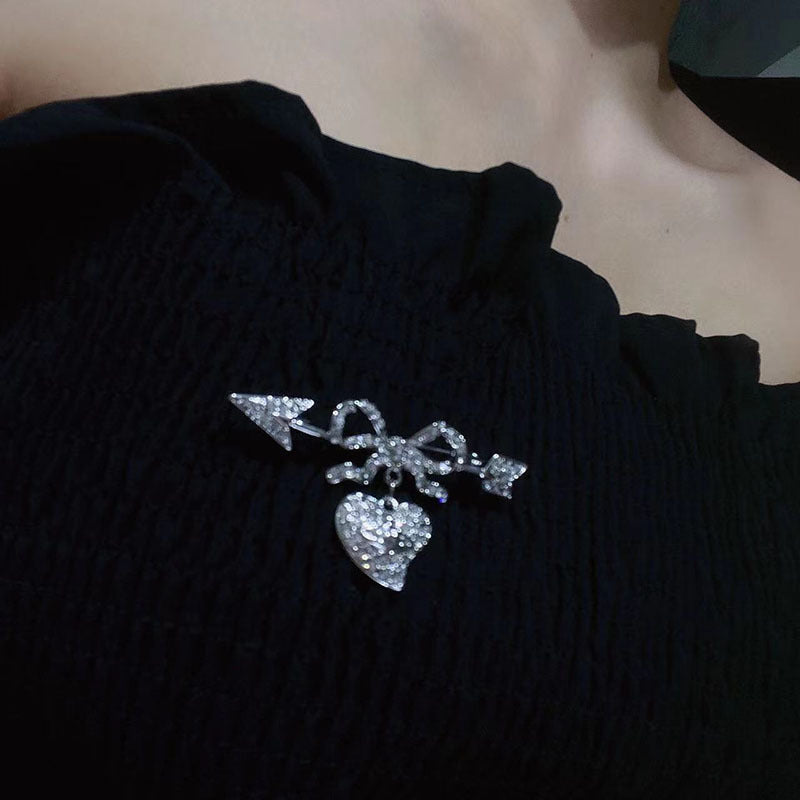 Vivienne Westwood full diamond studded heart-piercing silver brooch punk dress suit pin