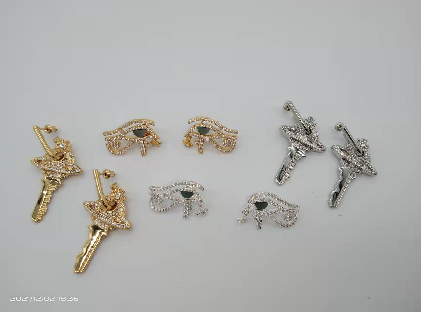 Vivienne Westwood Eye of Horus ear studs key earrings punk